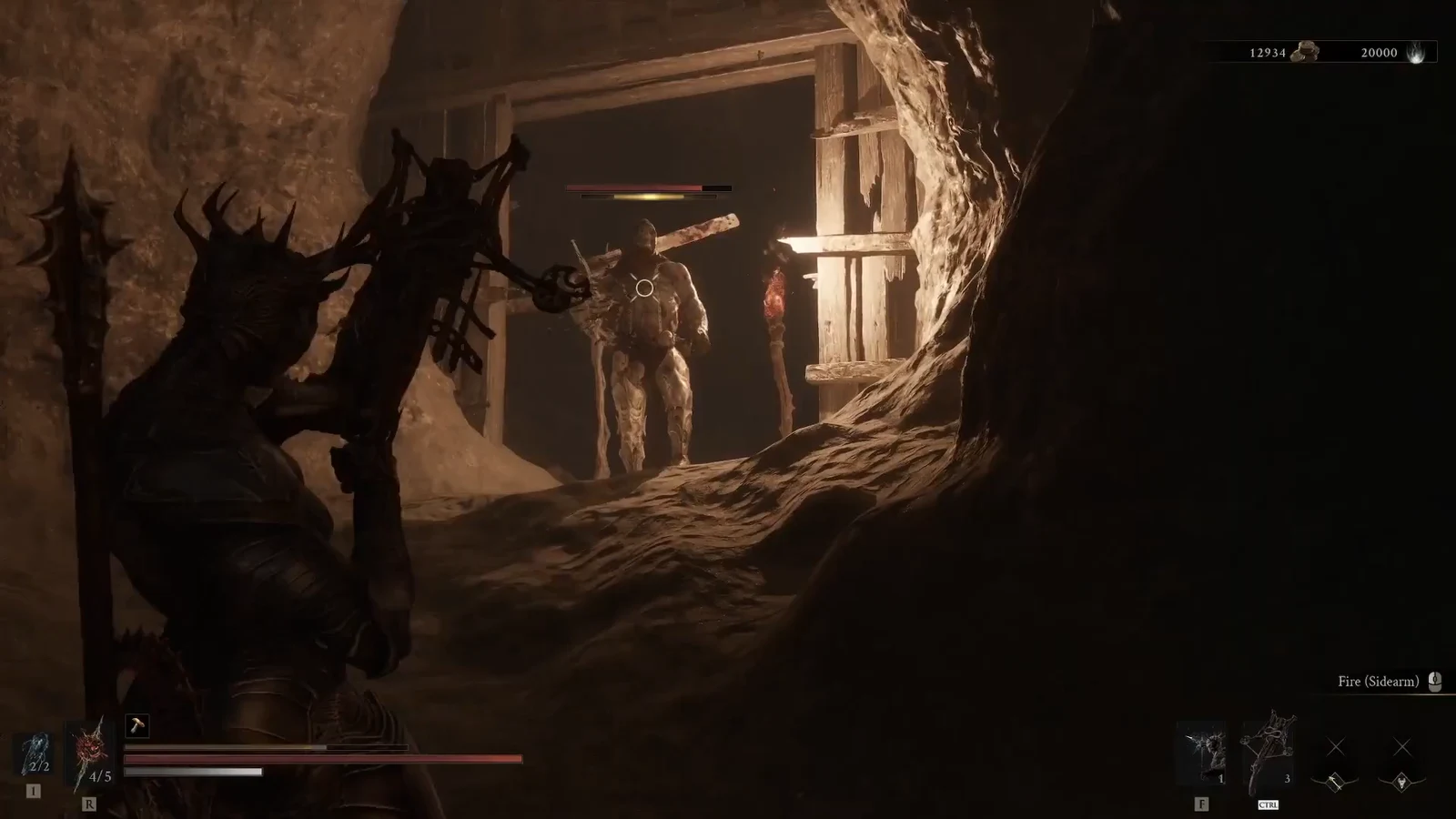 Player aiming a sidearm at an armored enemy approaching in a cave