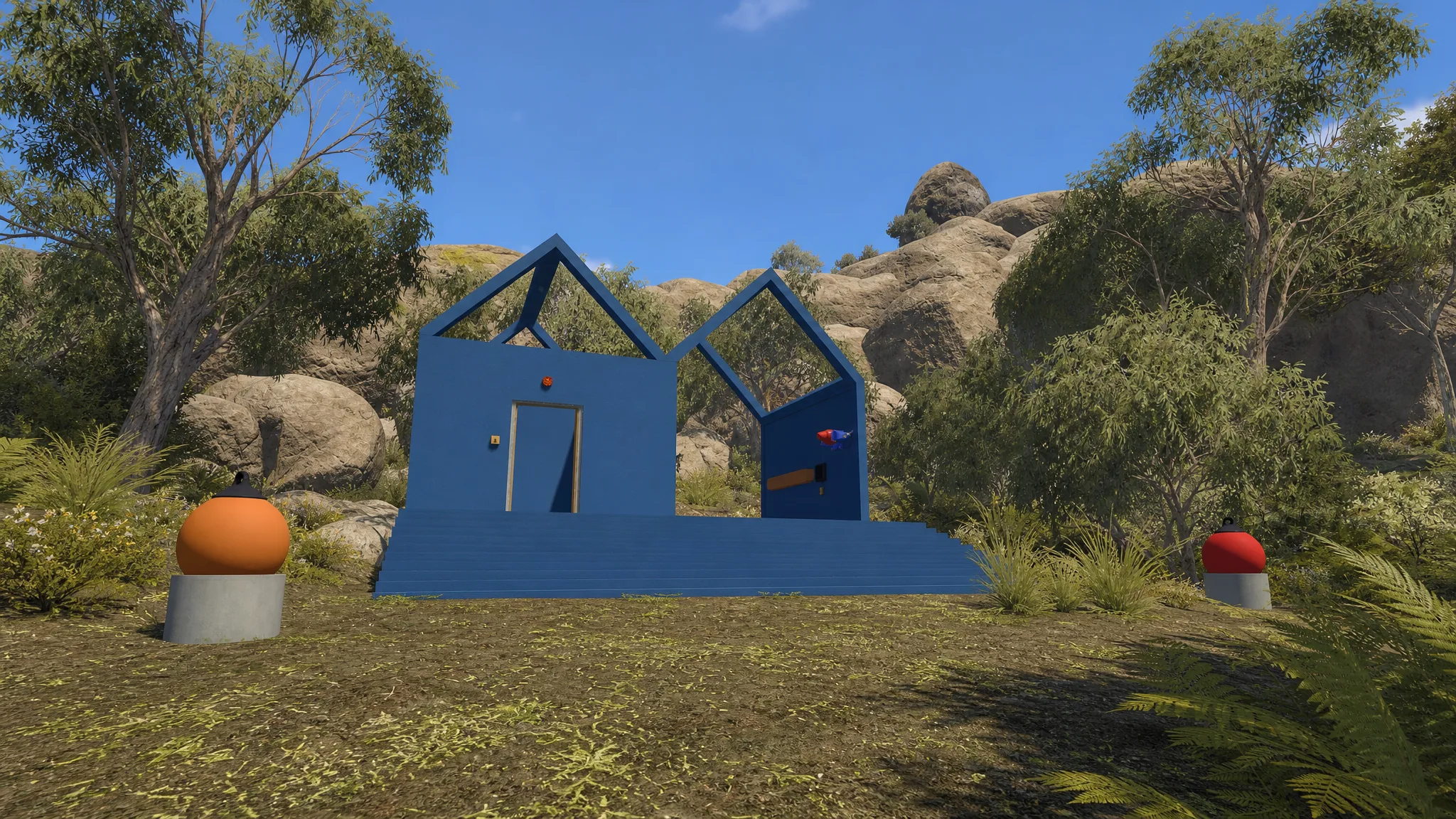 The blue house-like building in Big Walk that houses one of the drawbridge puzzles with the matching pictures