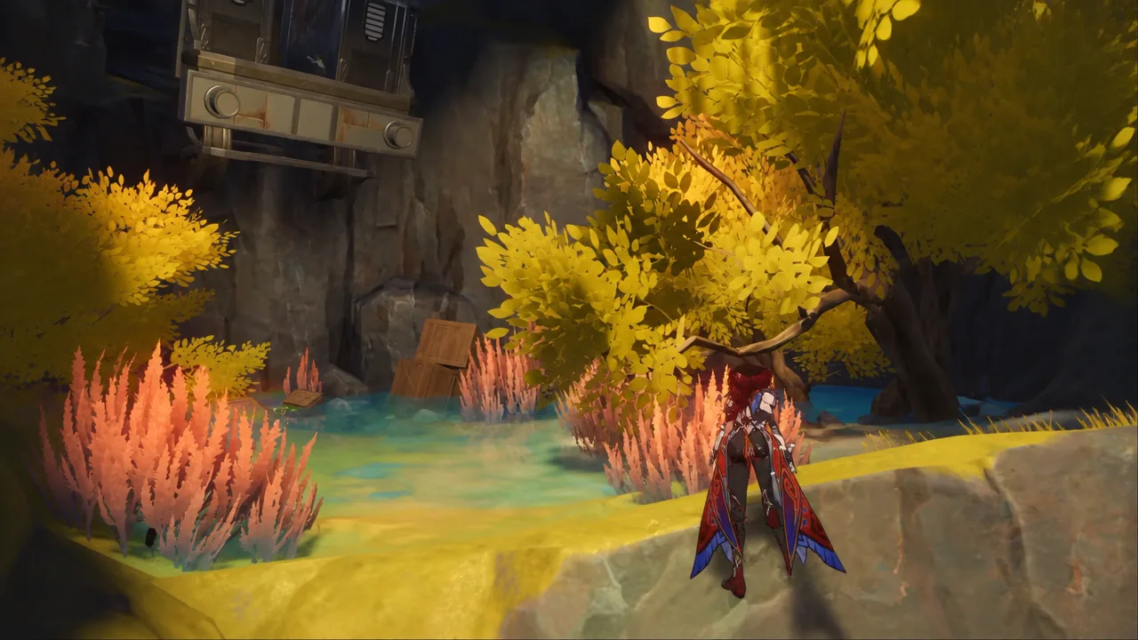 Character standing on a rocky ledge above a colorful pool inside the cave