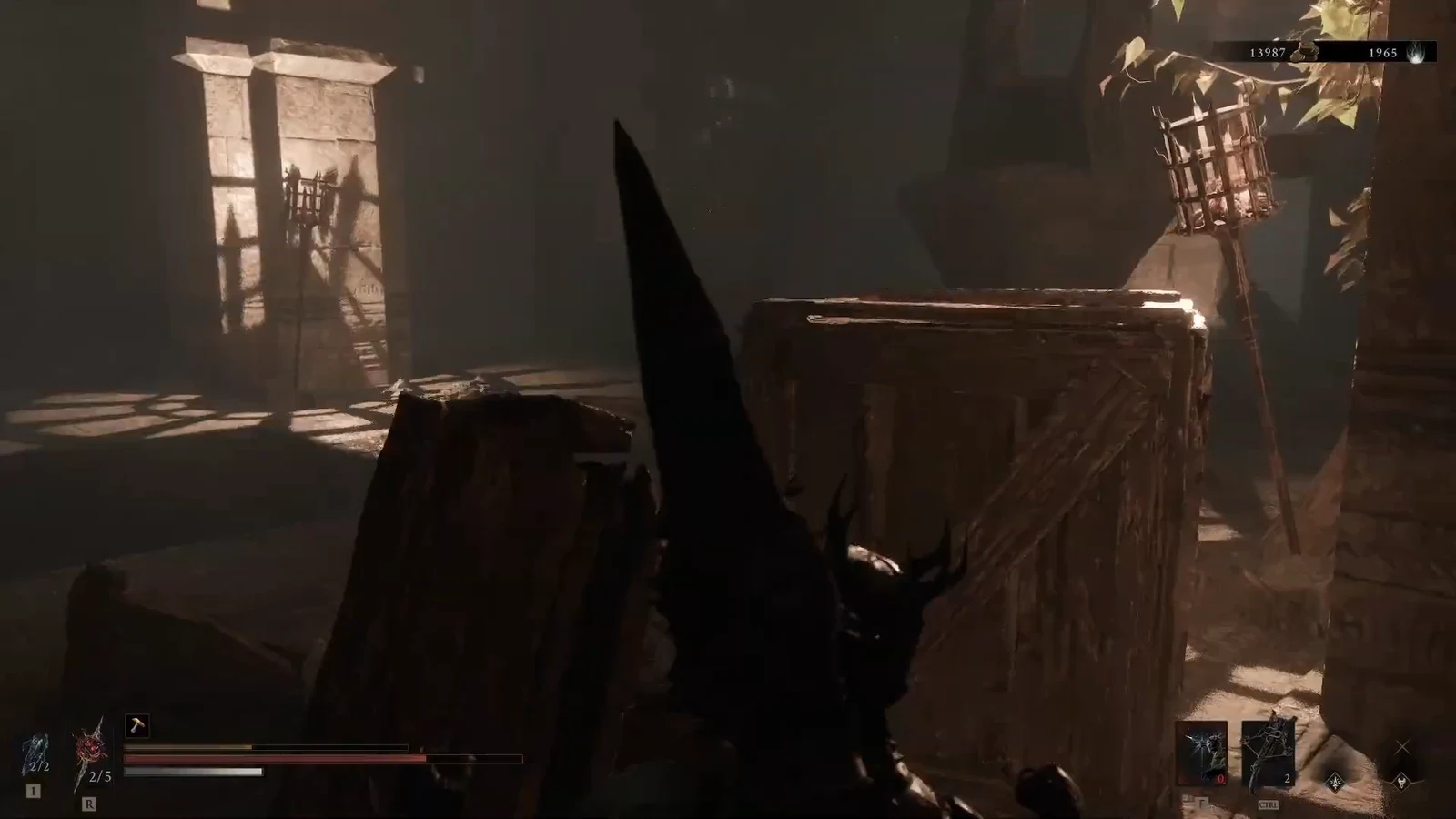 Player with a large black weapon approaching a wooden crate in a sunlit interior.