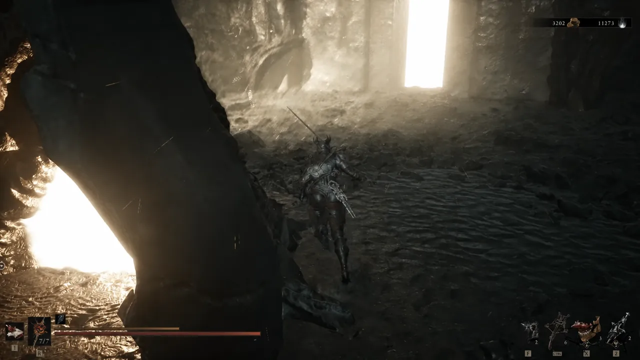 Player character walking through a dark cavern passage past the opened Corrupted Gate