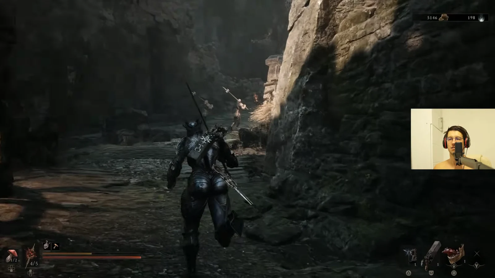 Armored character advancing through a rocky passage toward spear-wielding enemies