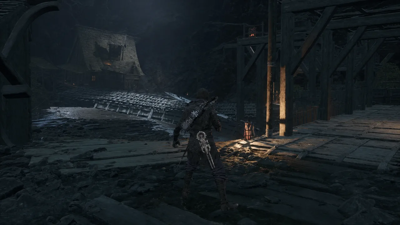 The scaffolding structure and wooden stairs leading down into the flooded lower level of the dungeon