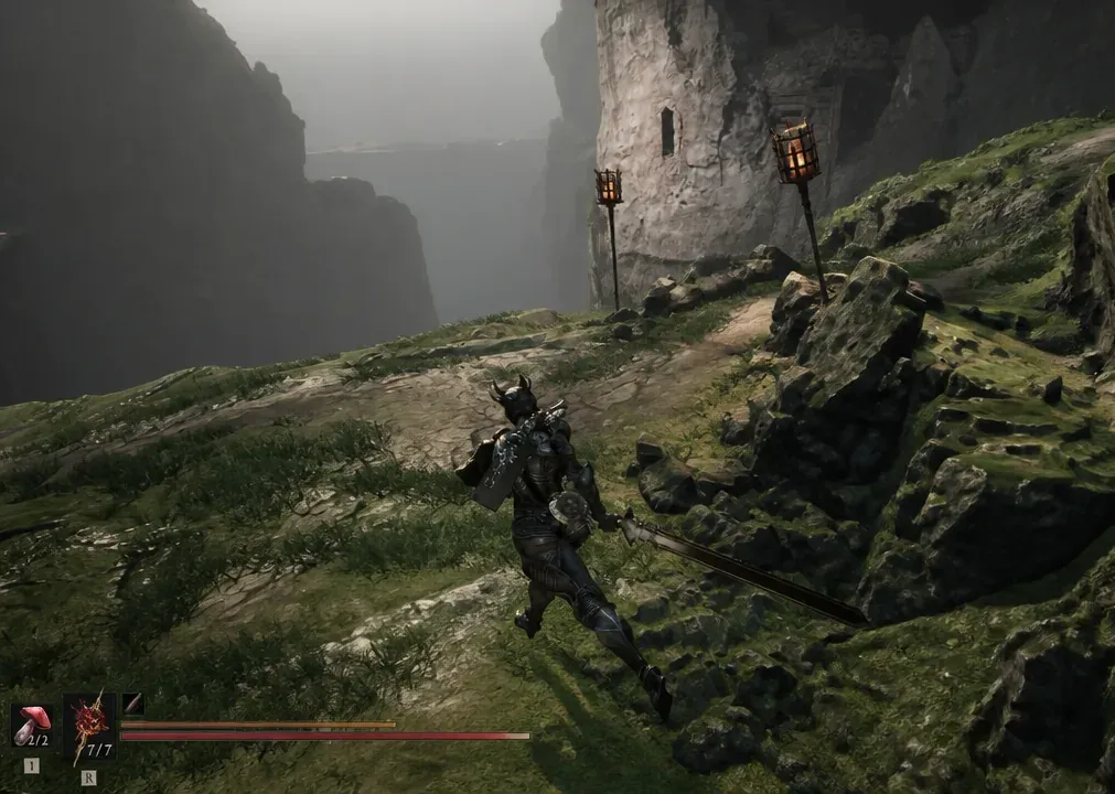 Armored character crossing a torchlit mountain path with sword drawn on the way to the temple