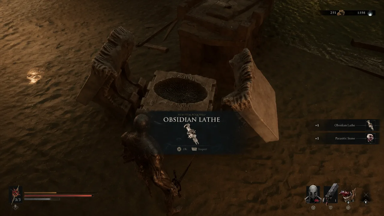 Item pickup overlay showing the Obsidian Lathe and Parasitic Stone rewards