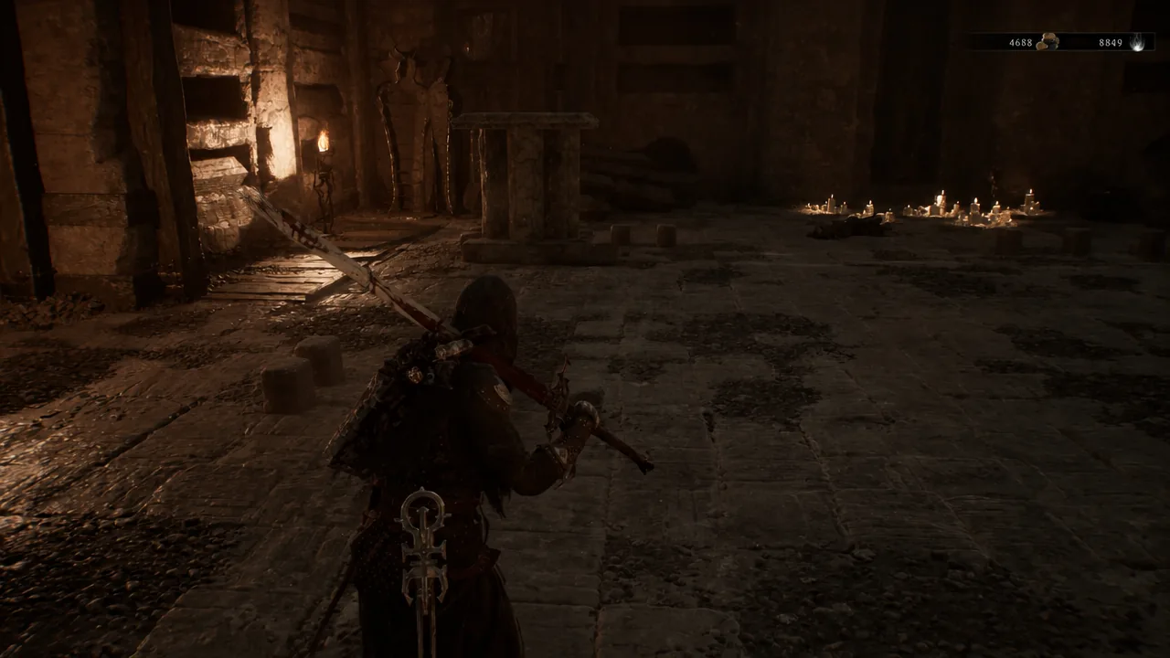 Hooded character explores a candlelit stone chamber with health and currency indicators on screen