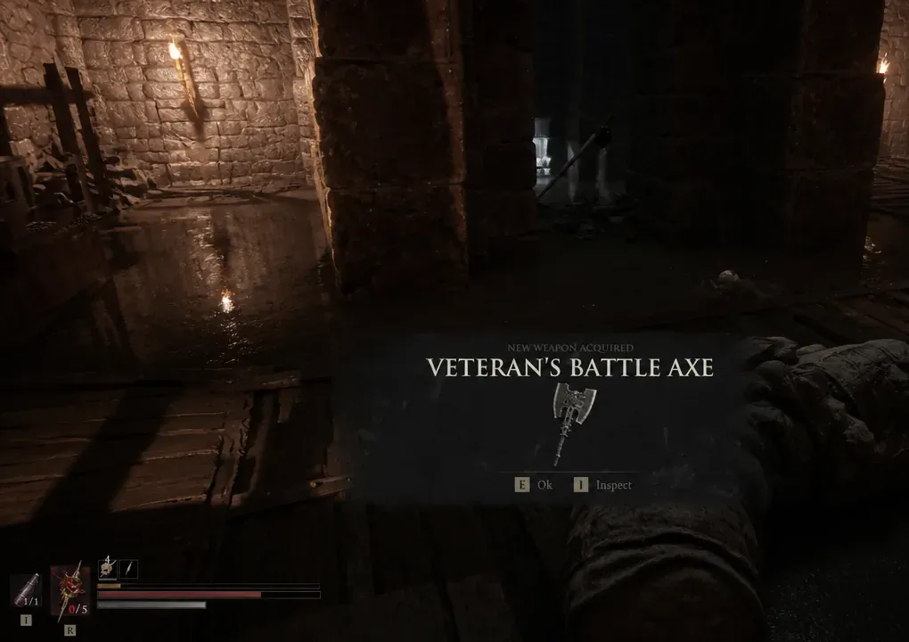 New Weapon Acquired screen showing the Veteran's Battle Axe with confirm and inspect prompts