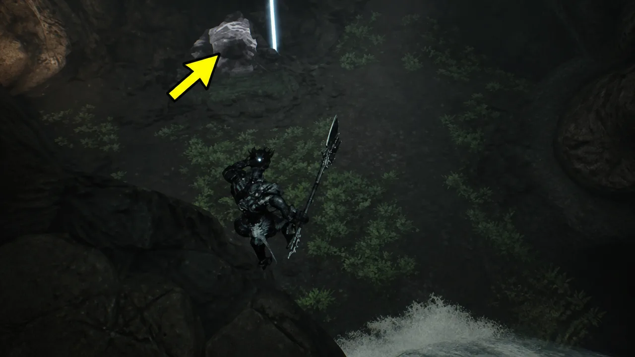 Yellow arrow marking a rock ledge beneath a vertical beam of light as the character approaches