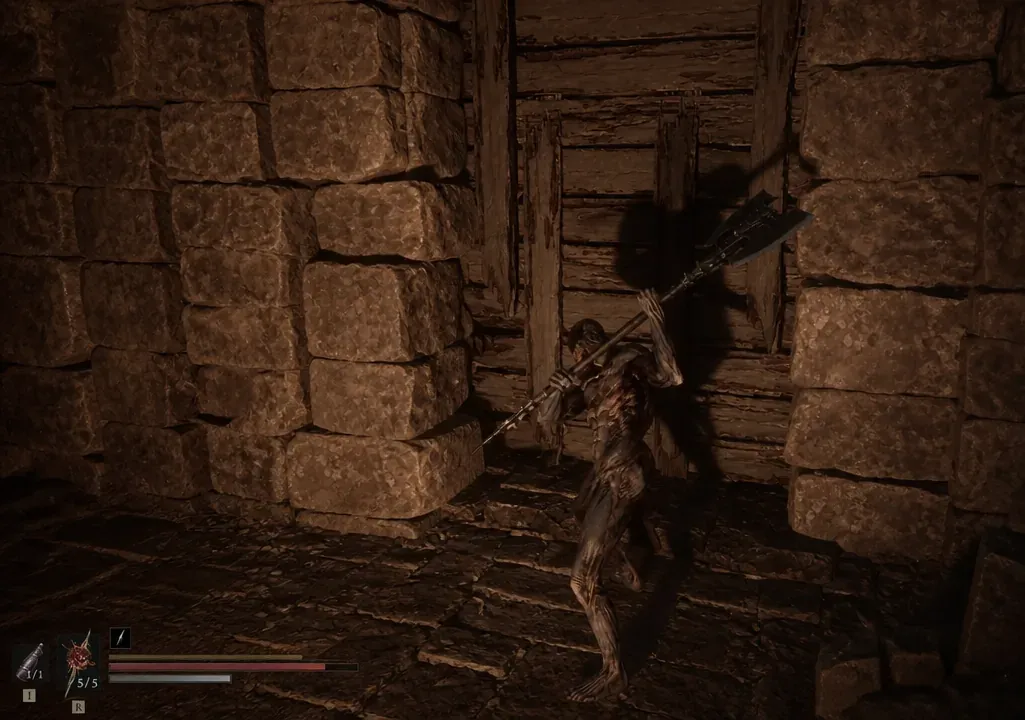 Player character raising a large polearm in front of a boarded wooden door in a stone corridor