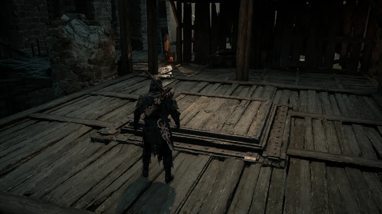 The player stands on a wooden platform overlooking the dark lower level of the Holding Cells