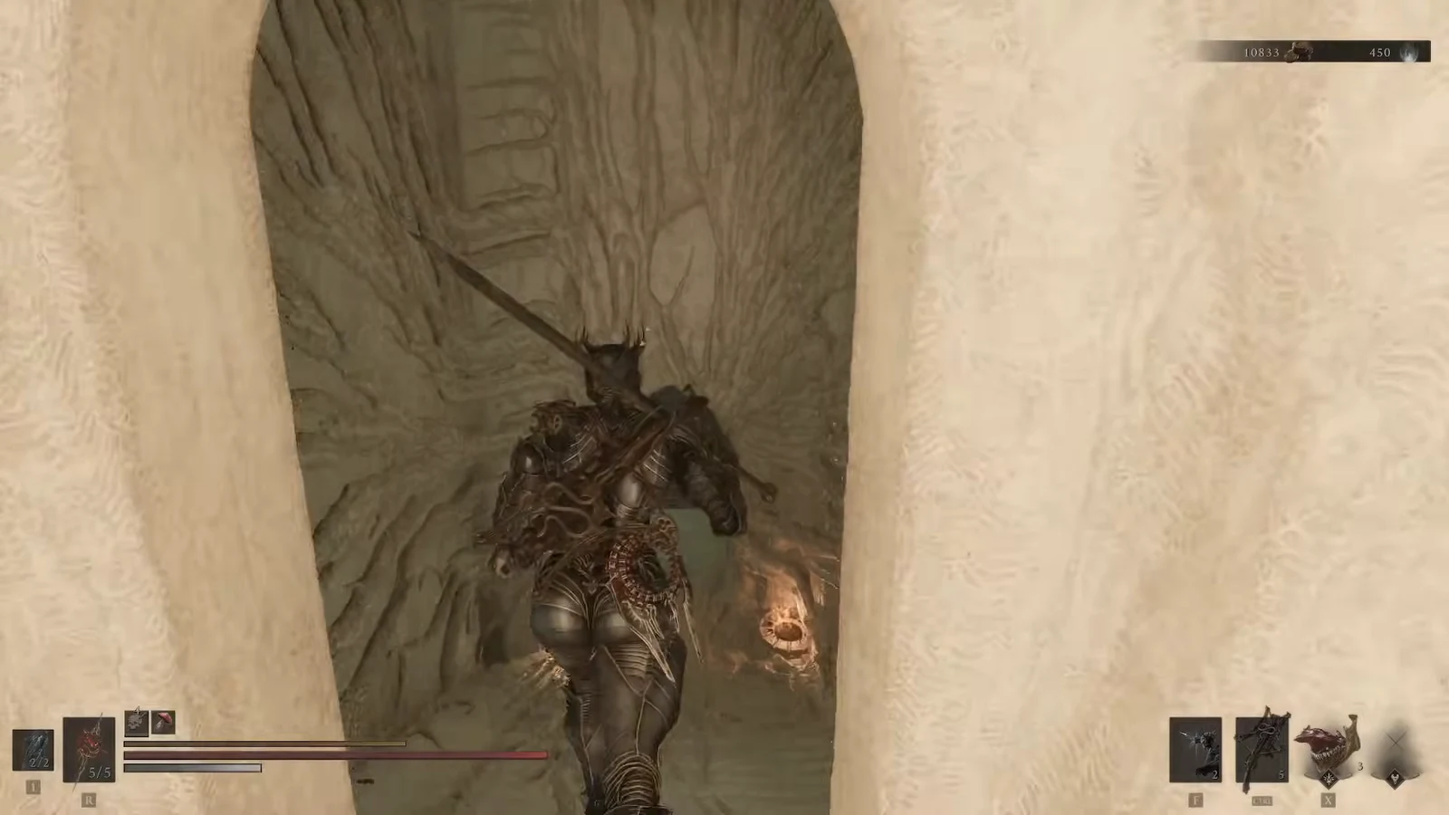 Armored Harbinger heading through a narrow stone doorway toward a lit passage inside the beacon