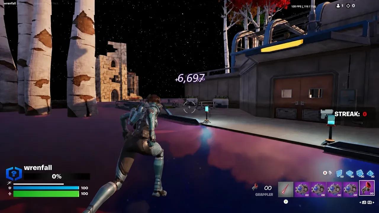 Third hidden XP button on the picnic table beside the right-hand building