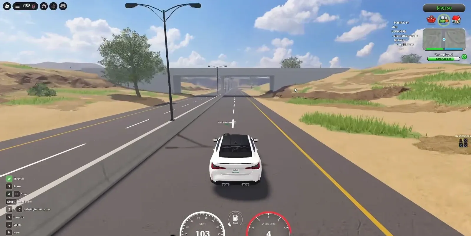 White car driving along the highway toward the hidden tunnel entrance