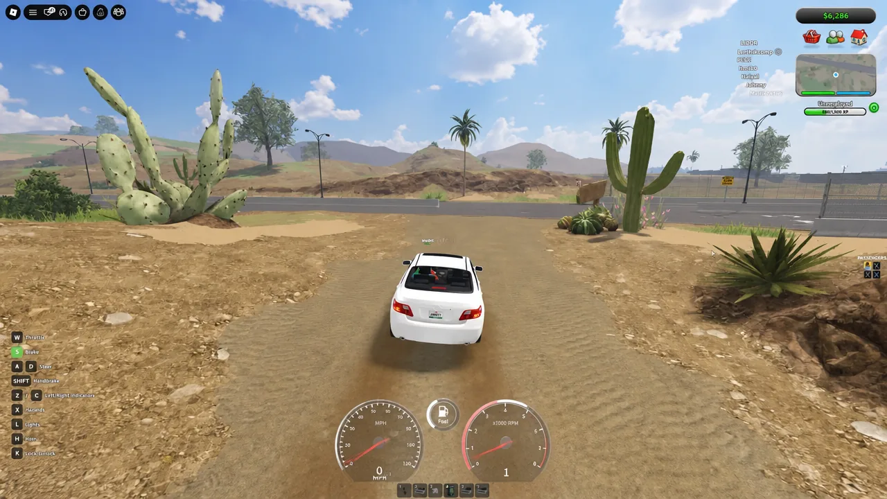 Player driving a white convertible down a dirt track toward the border area