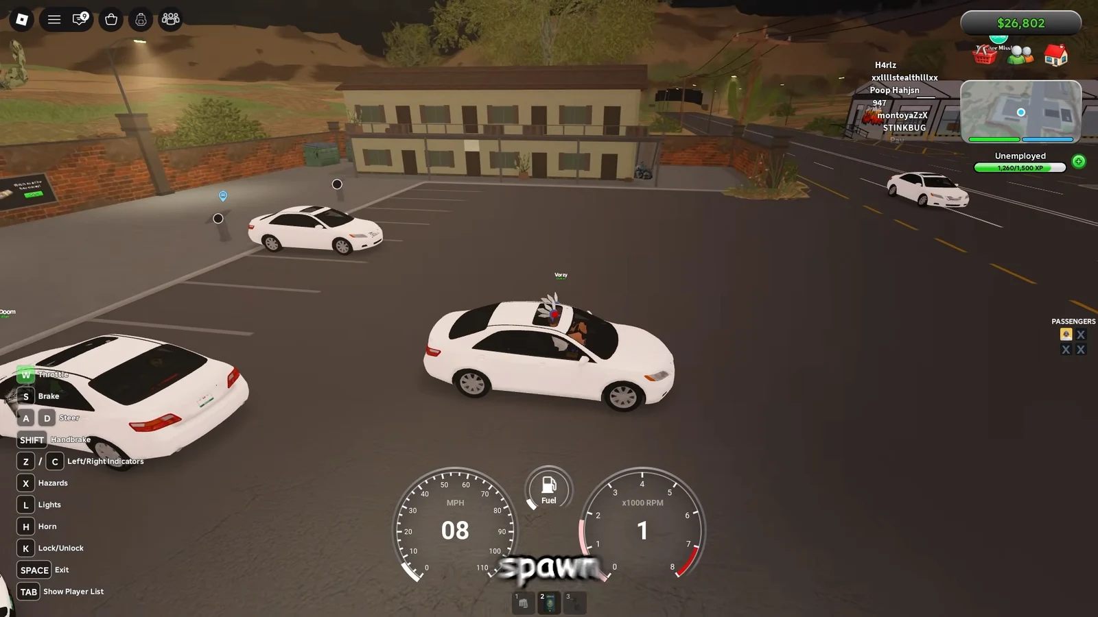 Player driving a white sedan through a parking lot toward the border tunnel