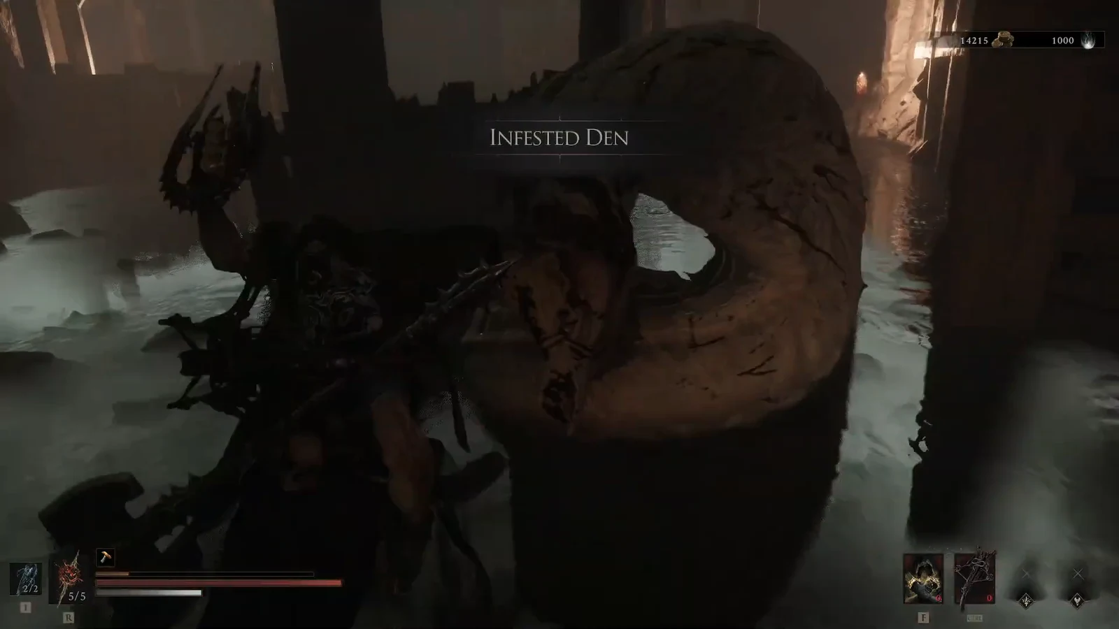 Infested Den area title on screen while the player fights a large worm enemy