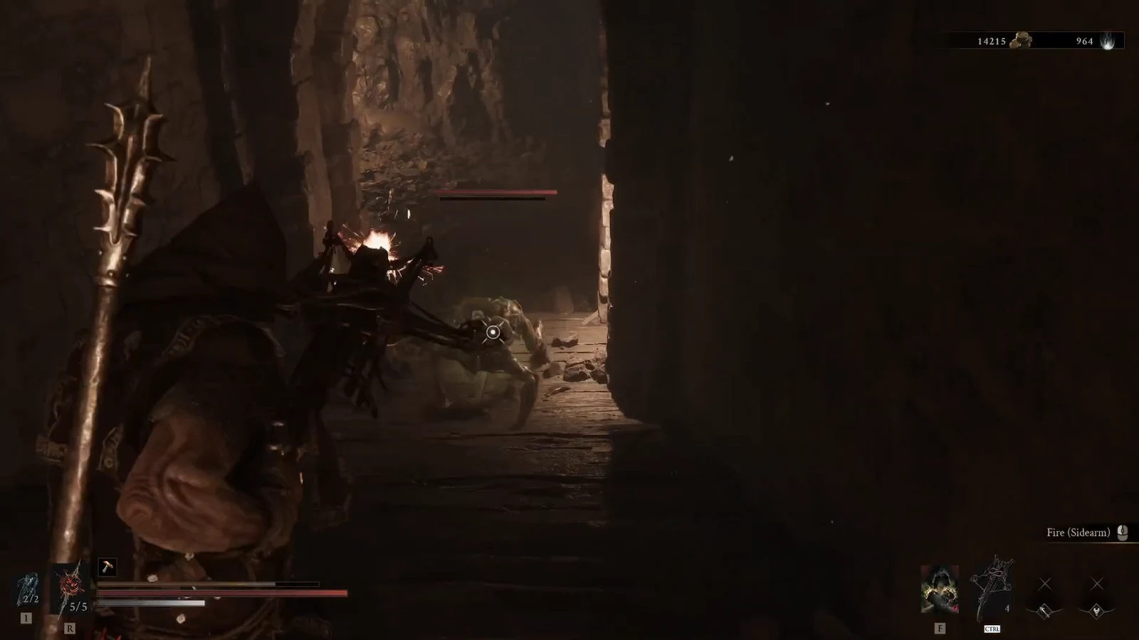 Player aiming the Fire sidearm at a stone enemy in a dark cavern corridor before the hidden wall