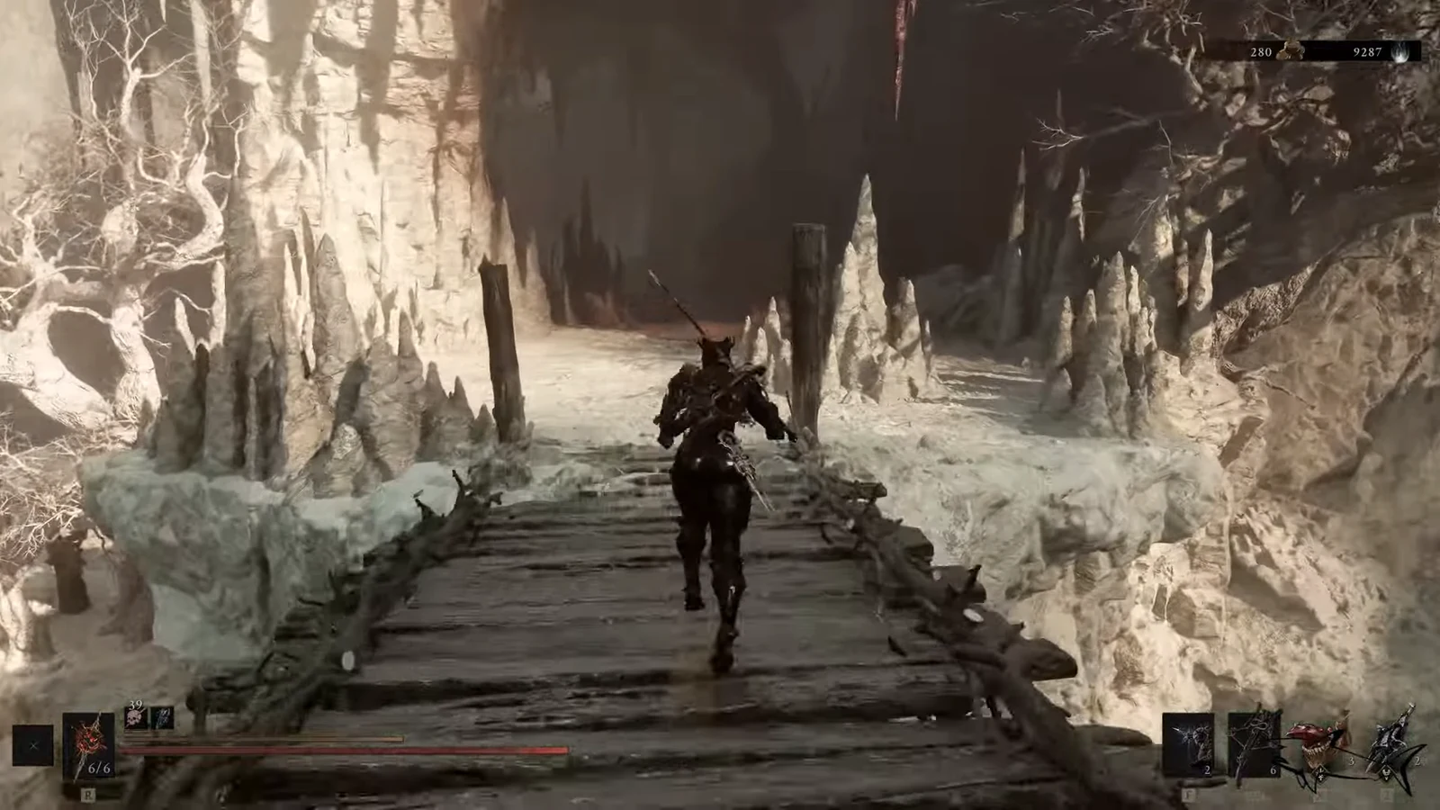 Armored character crossing a wooden bridge inside the icy Sanguine Caverns