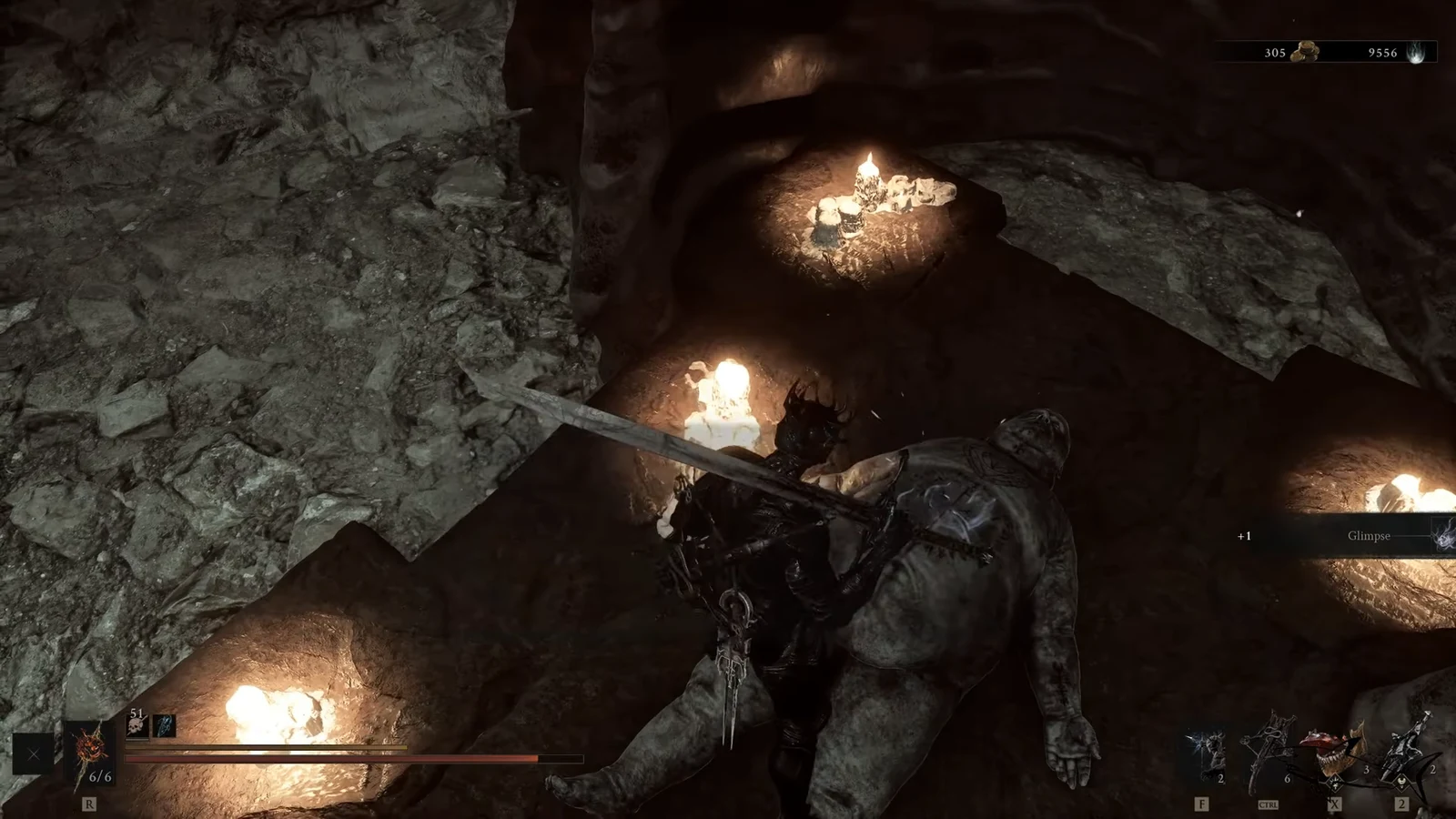 Character looting a corpse in a cave as a plus one Glimpse notification appears