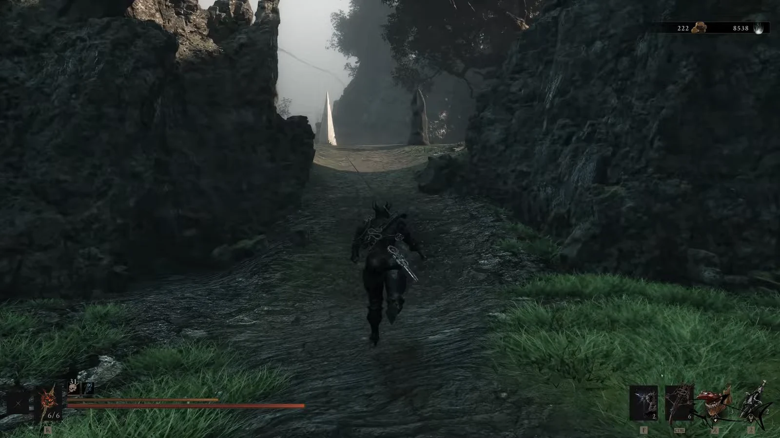 Armored character running up a rocky path toward a wooden bridge with the combat HUD visible