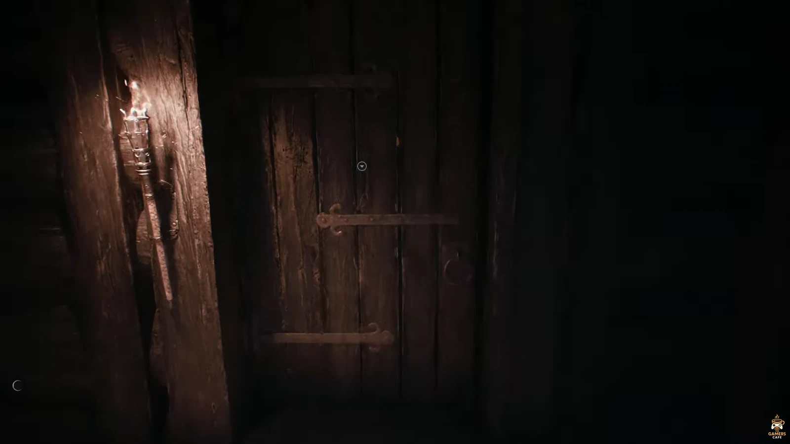 Wooden barred cabin door with the interaction cursor centered on it
