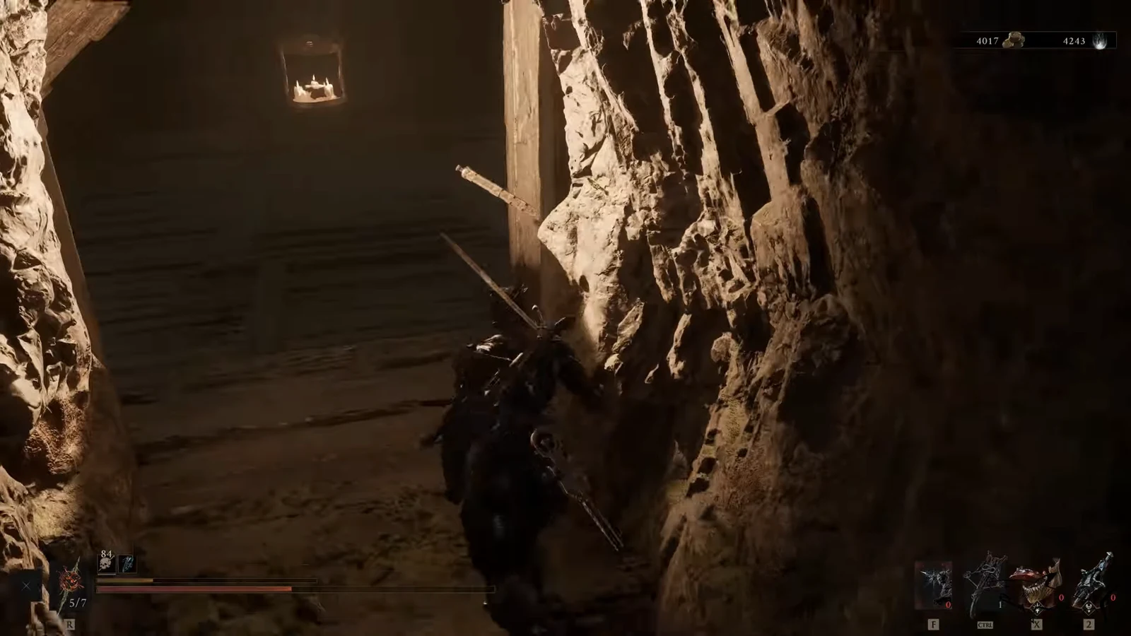 Harbinger walking through a torchlit rocky tunnel holding a sword and a ranged weapon