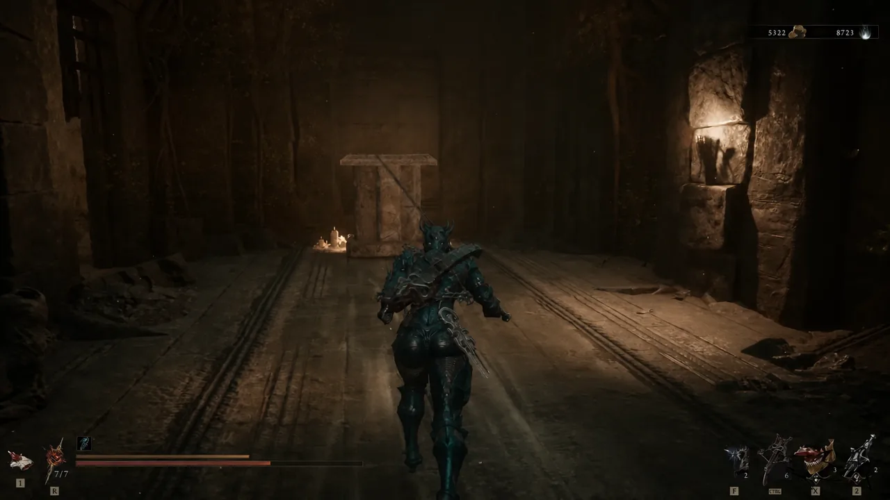 Shell advancing down the torchlit corridor beyond the opened gate in the Ravaged Tomb.