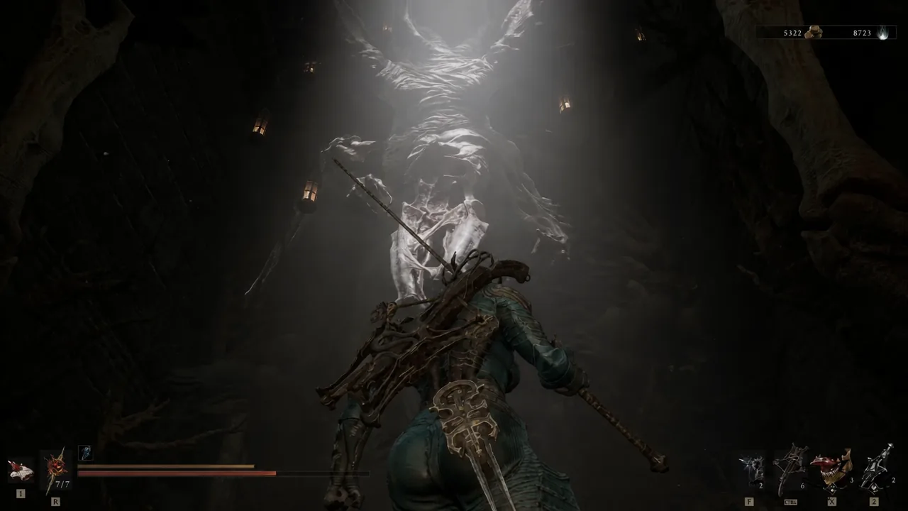 Player facing the towering spiked beast that guards the Ravaged Tomb exit gate.