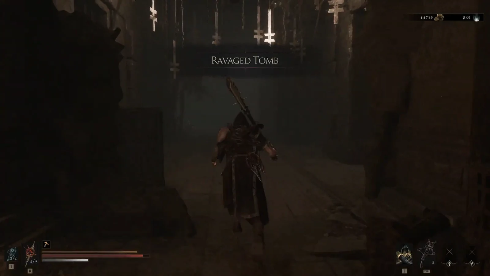 Ravaged Tomb title on screen as the character enters a dim tomb lined with crosses