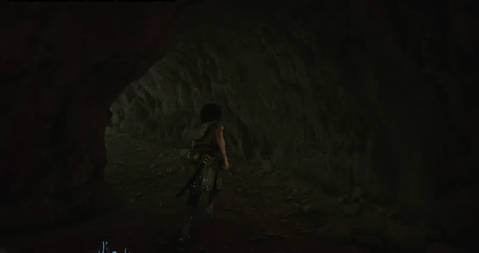 On-screen Artefact: Loving Memento notification as Sophia stands in a dark cave