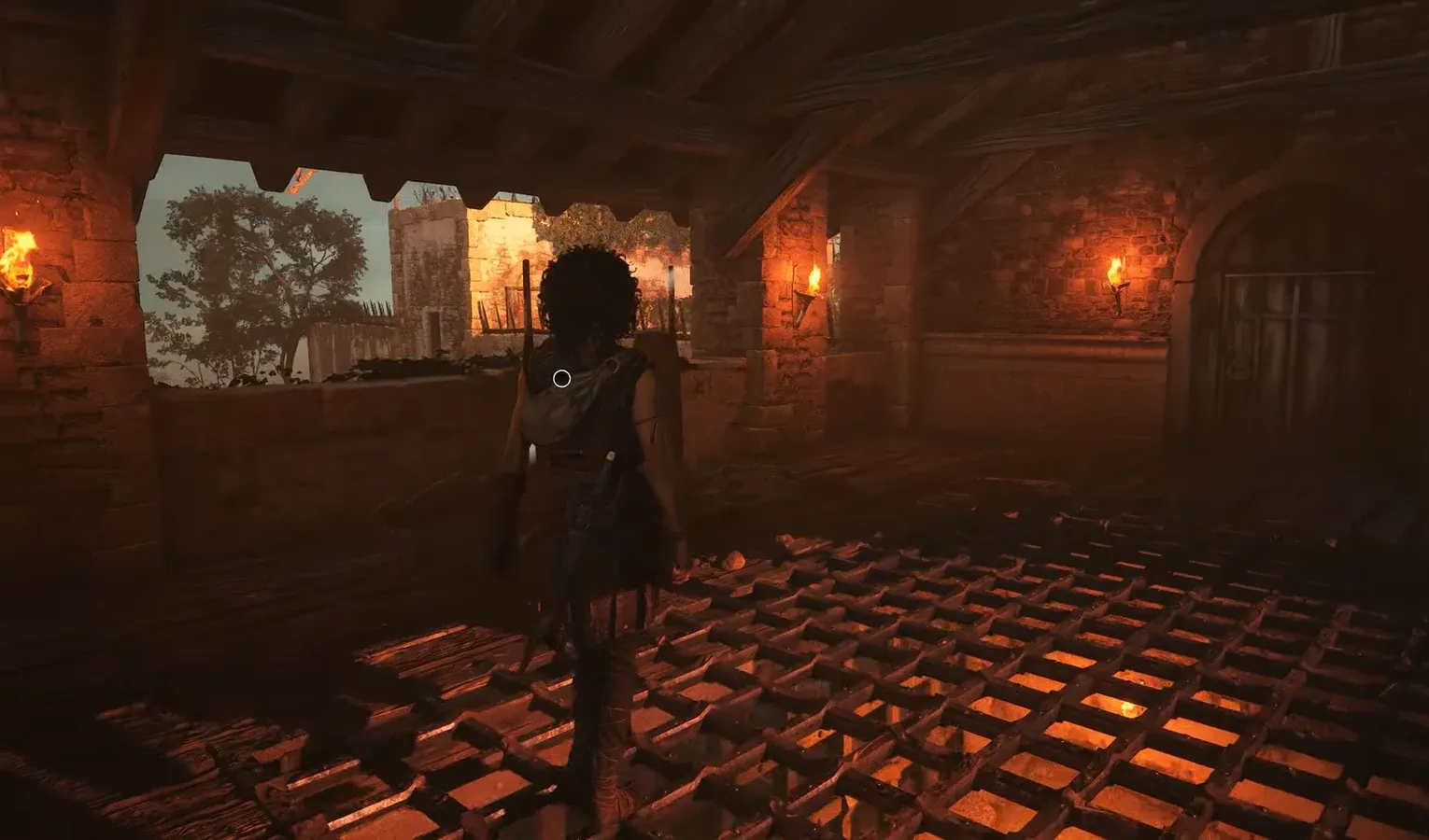 Character crossing a torch-lit stone chamber over a glowing metal grate toward the gate levers
