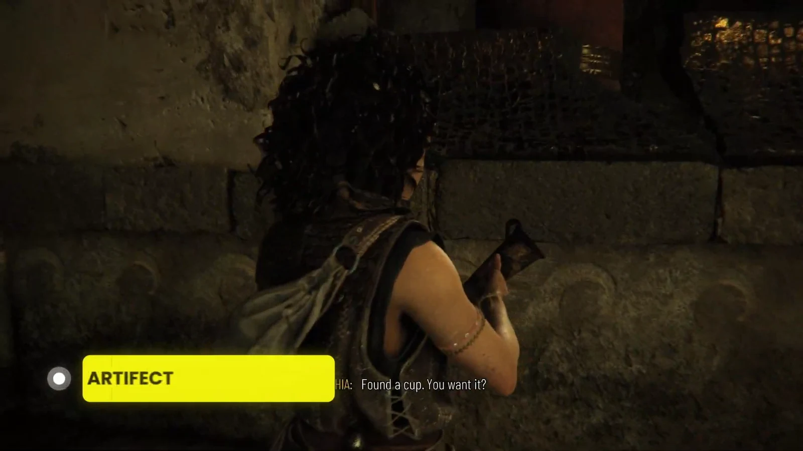 On-screen prompt highlighting ARTIFACT as Sophia accepts the Horned Rhyton cup