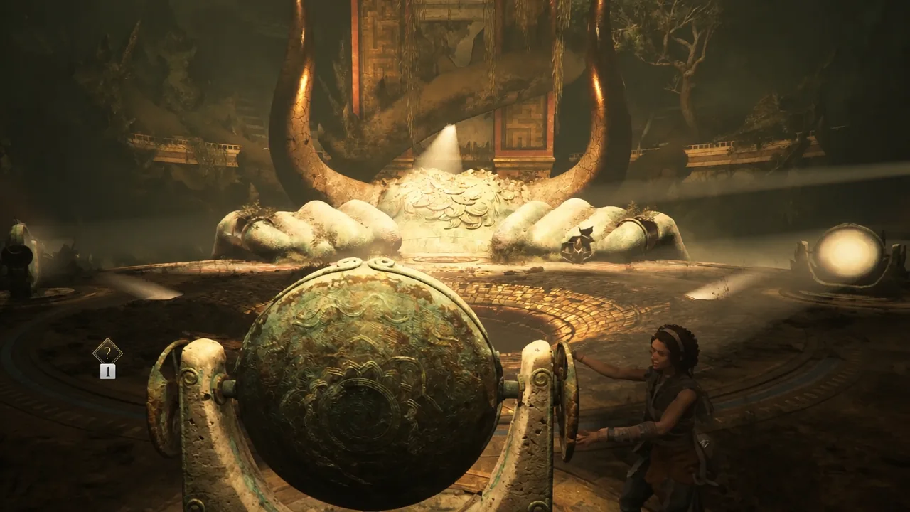 Sophia turns the ornate center mirror wheel with the horned statue looming ahead