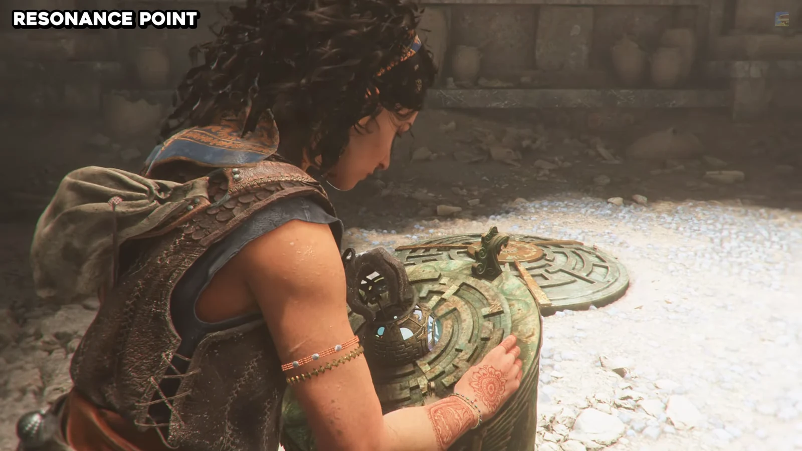 Sophia placing her hand on a circular stone pedestal to activate the sphere mechanism