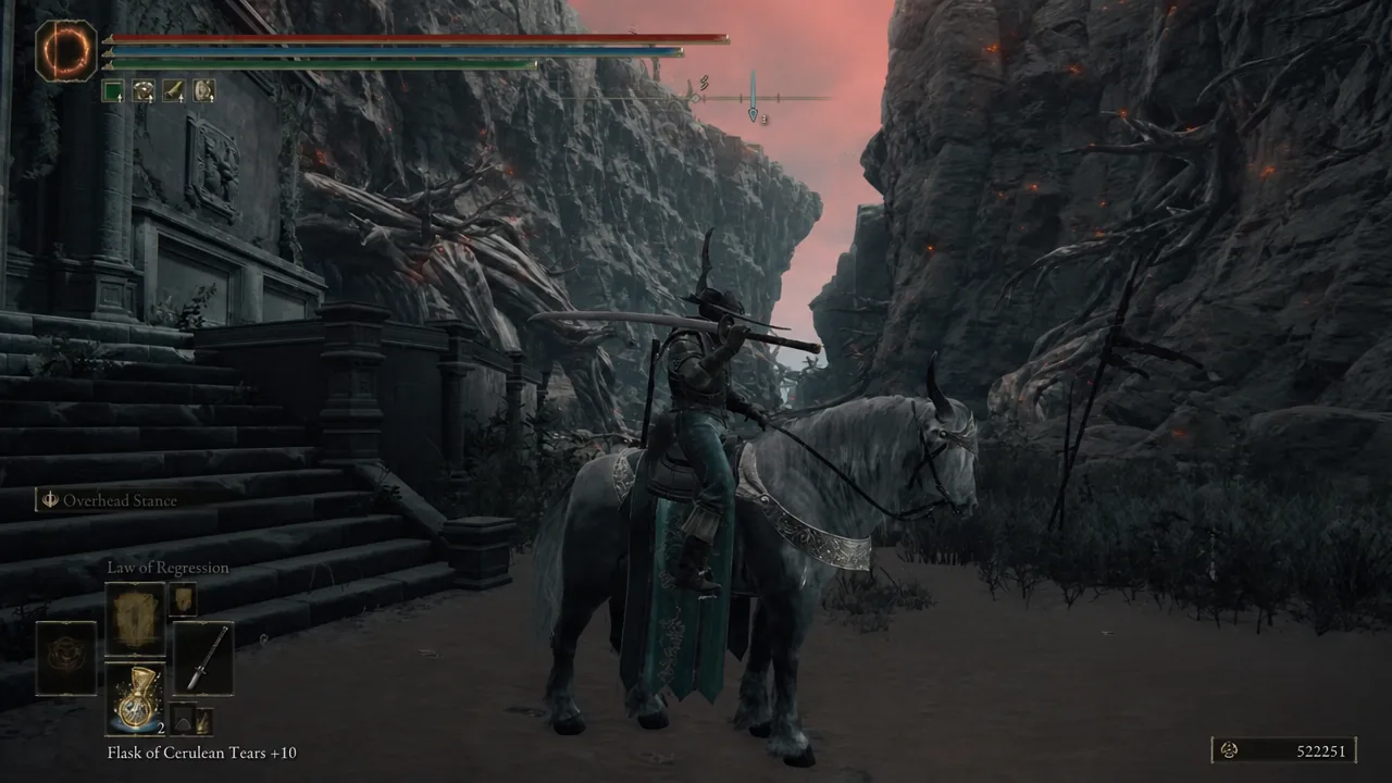 Mounted gameplay in the Caelid canyon with the Flask of Cerulean Tears +10 selected in the quick slot