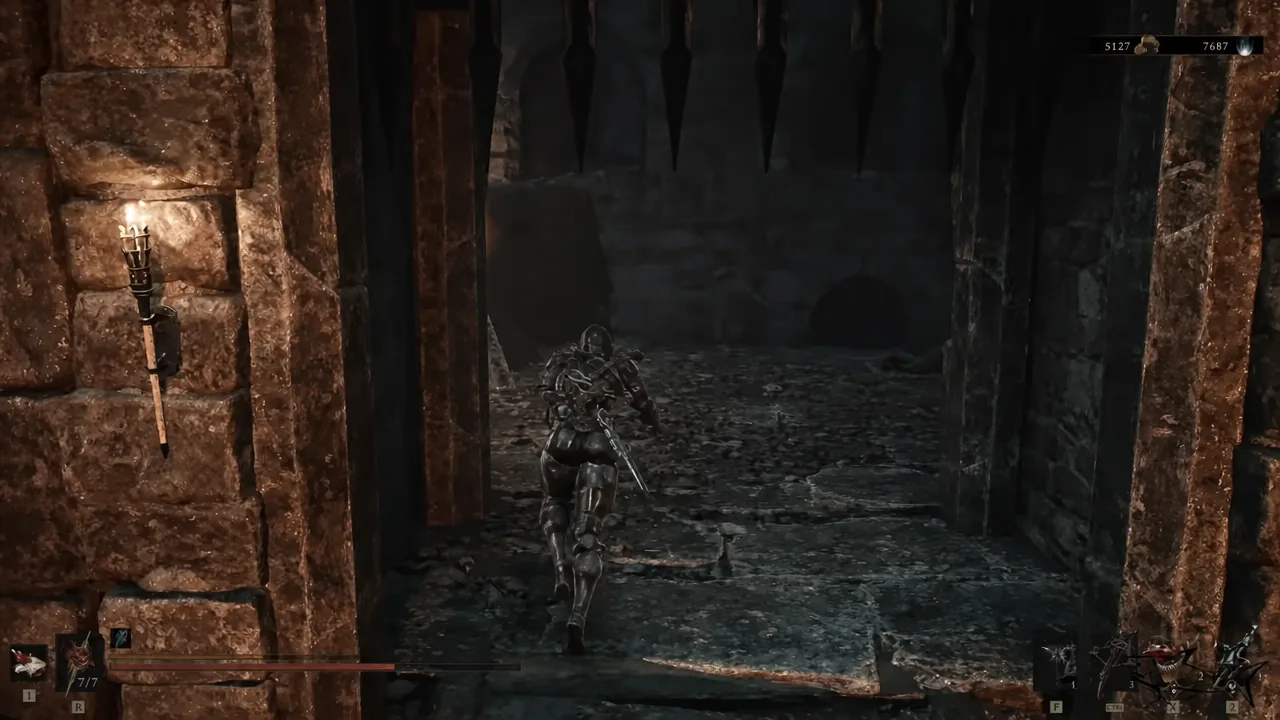 A dark stone corridor leads to the iron gate you unlock for the Nochtean Gate Beacon.
