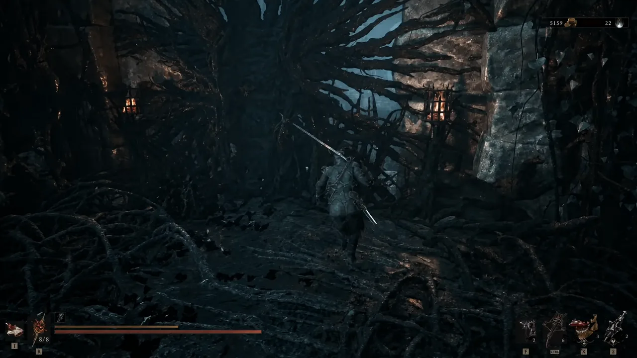 Player character with sword drawn picking a route through a dark cavern filled with thick roots