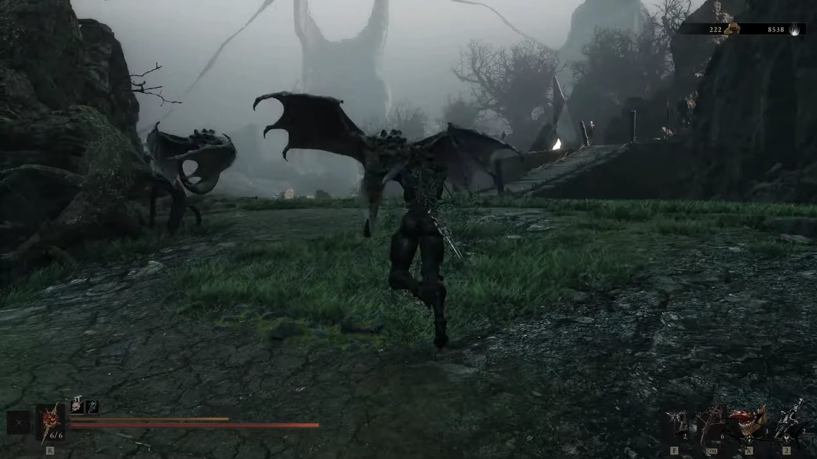 Character advancing toward two winged enemies in a foggy outdoor area with the ability HUD showing
