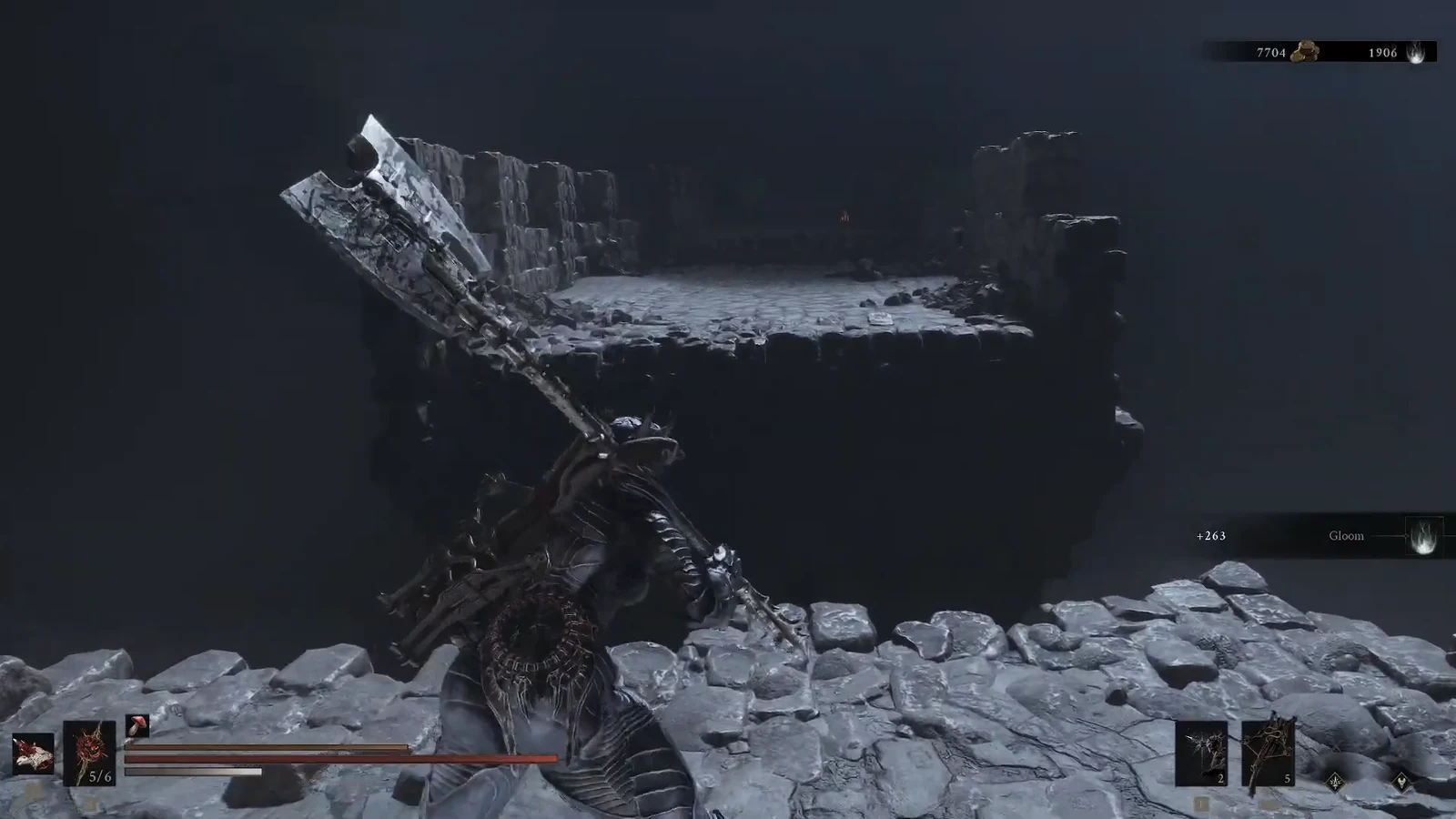 Character wielding a greatsword approaching a broken stone platform across a gap in a dark area