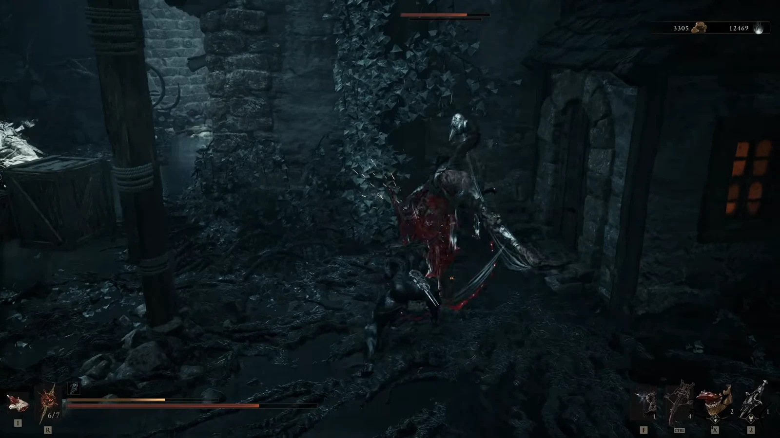 Player striking a hooded armored enemy inside a dark stone room, enemy health bar half drained