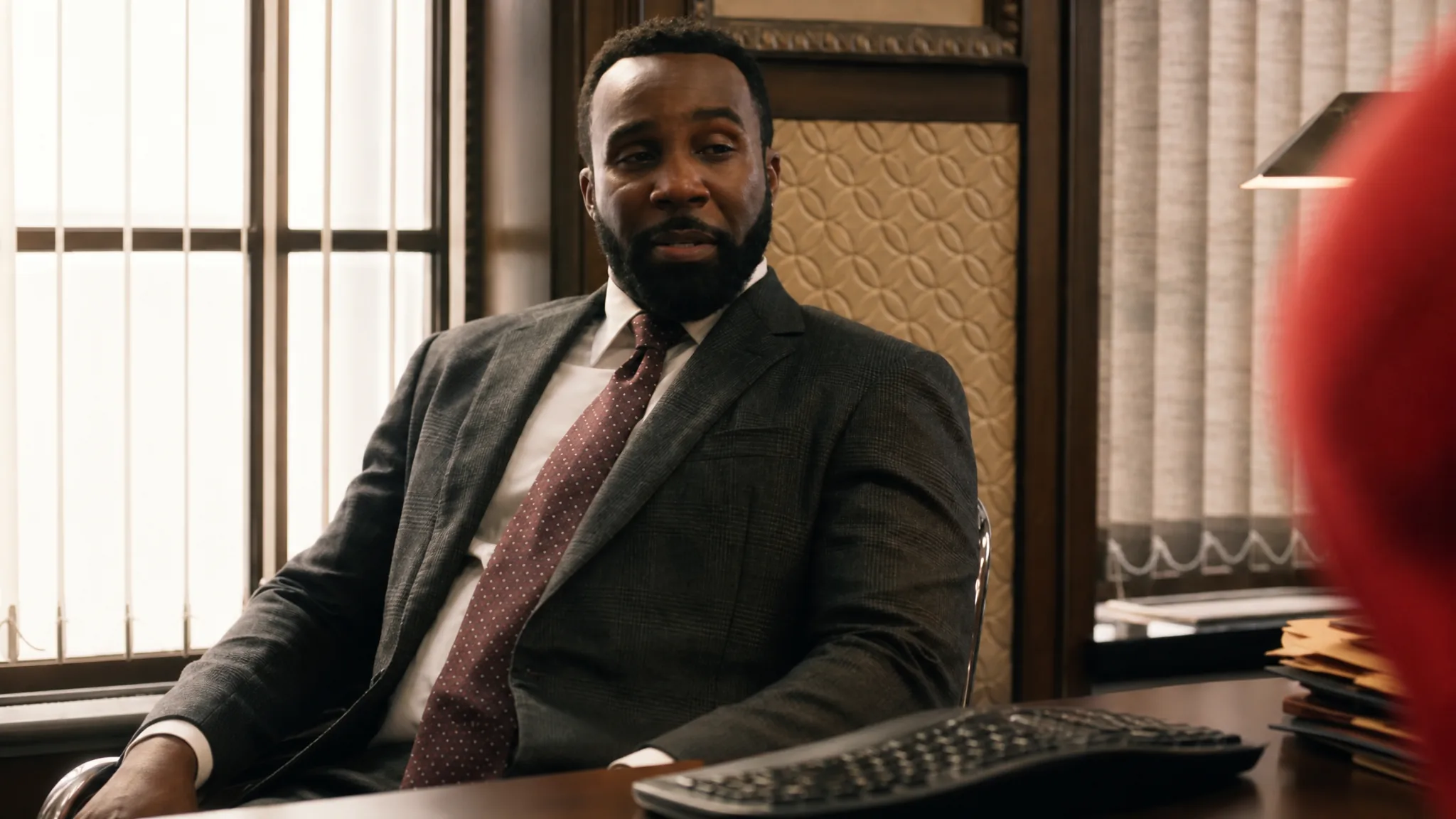 Tramell Tillman's William Metzger speaks to Spider-Man from across his desk in his office at Damage Control HQ in Spider-Man: Brand New Day
