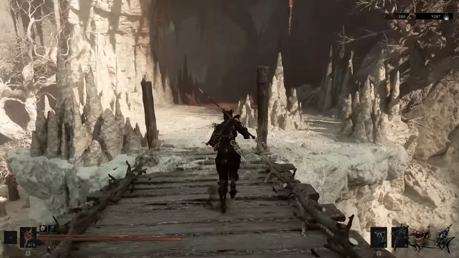 Player character running across a wooden bridge through an icy cavern toward a dark passage