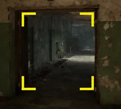 Yellow corner markers frame the doorway ahead as Skif looks down the tunnel corridor.