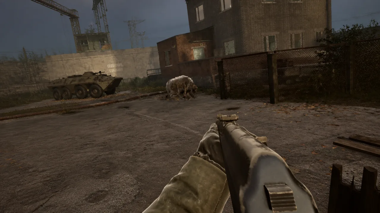 Rifle sights lined up on a boar charging across an industrial yard