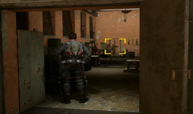 Interaction prompt highlighting a door inside the Monitoring Spot building as the player approaches