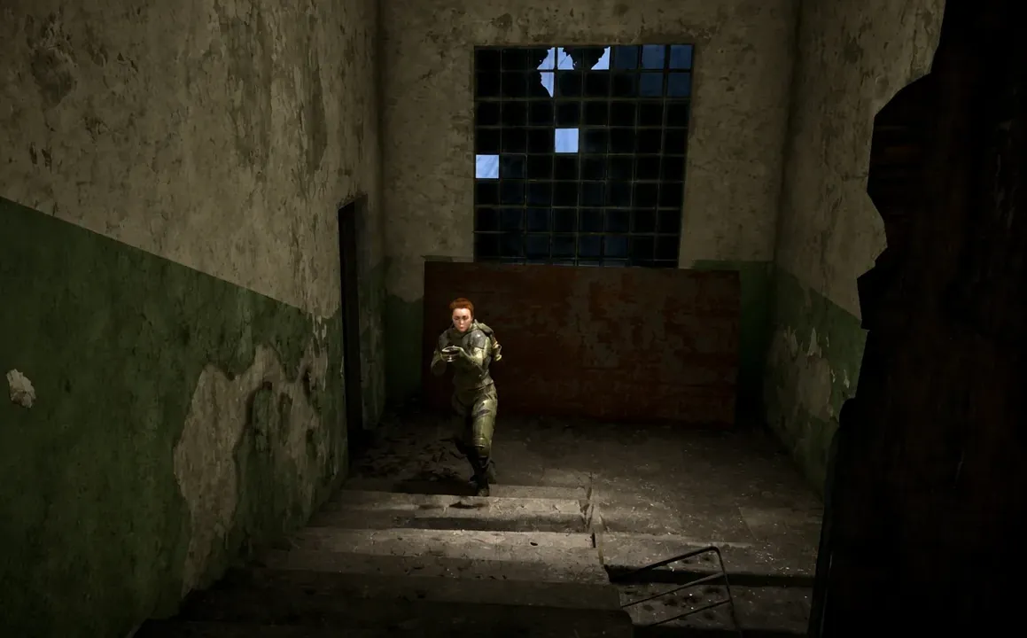 Player climbing an exterior stairwell on the side of the vehicle workshop building