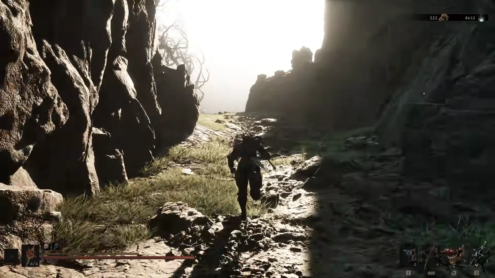 Armored character running through a narrow rocky canyon with the HUD visible