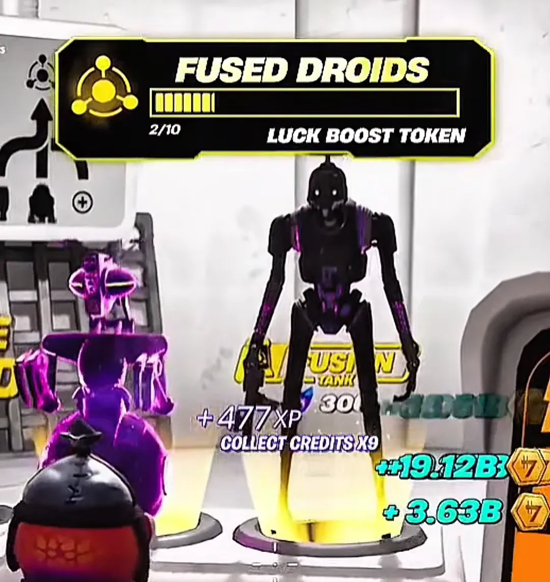 Fused Droids screen at 2/10 Luck Boost Token as credits collect from the machine