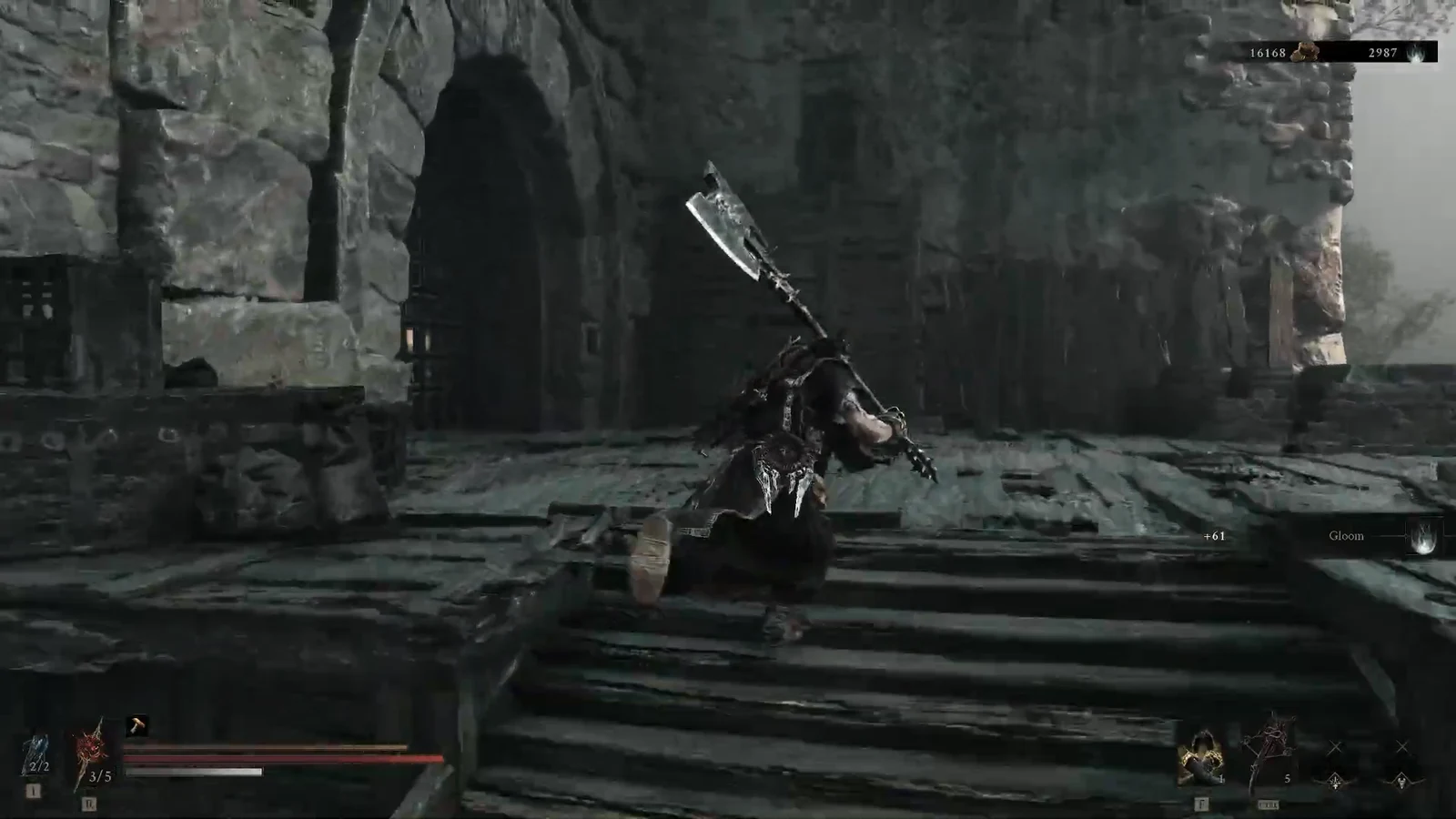 Player with a huge greatsword climbing stone stairs through a ruined fortress yard