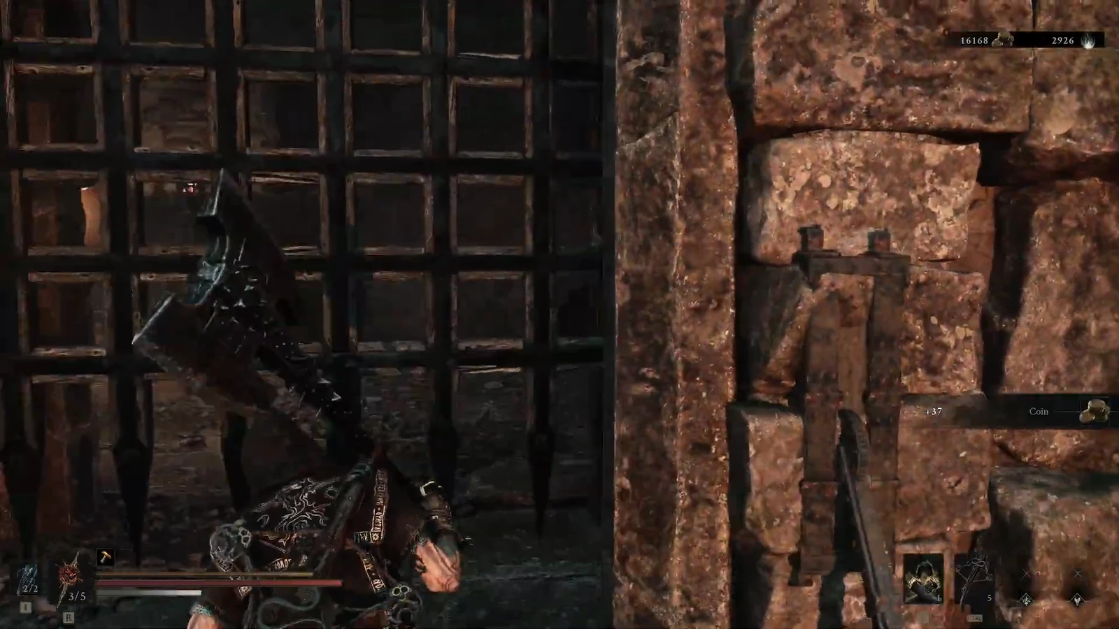 Armored player standing in front of a large barred gate set into a stone wall